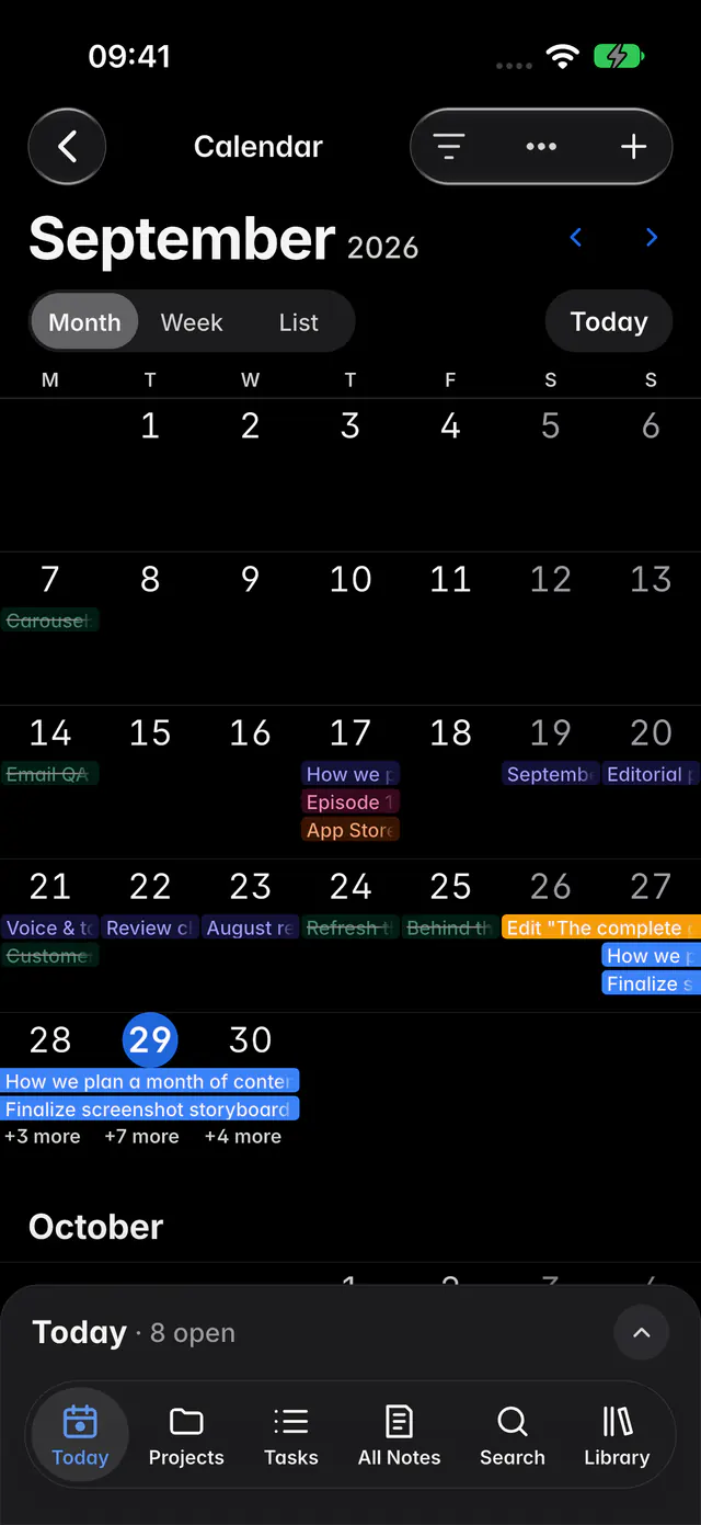 A calendar month with tasks on their days and multi-day tasks as bars (an iPhone)