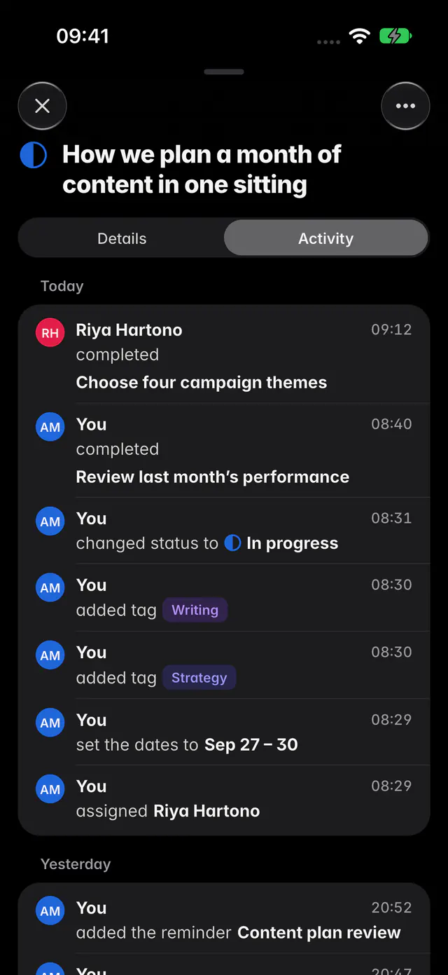 A task's Activity tab listing who completed, changed, tagged and assigned it, grouped by day (an iPhone)